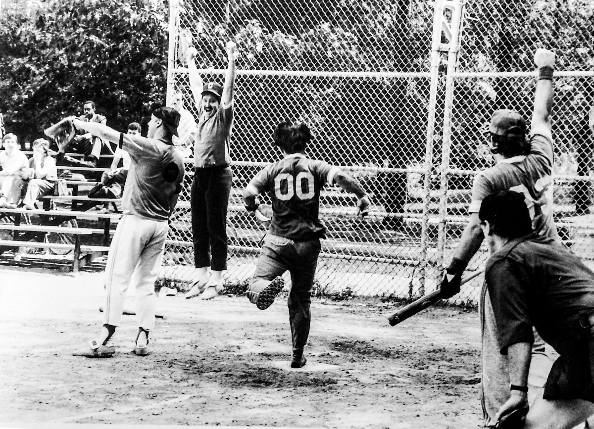 The AP's John Kekis crosses the plate in a 1985 semifinal win over McMane's (left) UPI.